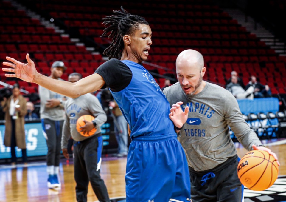 <strong>Tigers guard Emoni Bates (left) runs through drills with assistant coach Cody Toppert (right) during practice day of the NCAA Tournament on Wednesday, March 16, 2022 in Portland, Oregon. Bates will be available to play against Boise State in the Tigers&rsquo; first-round game</strong><strong> of the NCAA Tournament.</strong> (Mark Weber/The Daily Memphian)