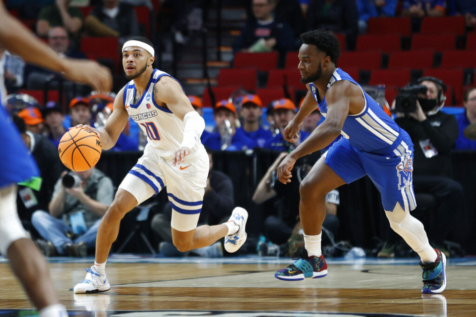 <strong>Boise State guard Marcus Shaver Jr. (10) drives past Memphis guard Alex Lomax, right, during the first half of a first round NCAA college basketball tournament game, Thursday, March 17, 2022, in Portland, Oregon.</strong> (Craig Mitchelldyer/AP)