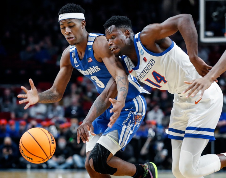 <strong>Tigers defender Landers Nolley II (left) battles Boise State forward Emmanuel Akot (right) for a loose ball on Thursday, March 17, 2022, in Portland, Oregon.</strong> (Mark Weber/The Daily Memphian)