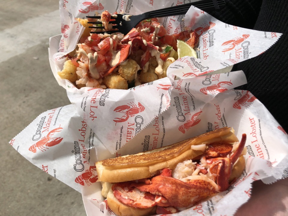 <strong>The Connecticut Roll (foreground) is served warm with butter and lemon on a toasted Country Kitchen roll, while the lobster tots features a generous helping of lobster over a bed of tater tots with pico de gallo and lime-cilantro sauce. </strong>(Jennifer Biggs/Daily Memphian)