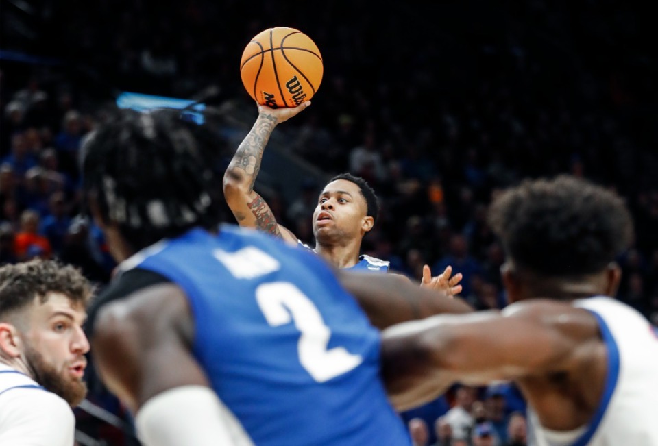 <strong>Tigers guard Tyler Harris (top) shoots over Boise State on Thursday, March 17, 2022, in Portland, Oregon.</strong> (Mark Weber/The Daily Memphian)