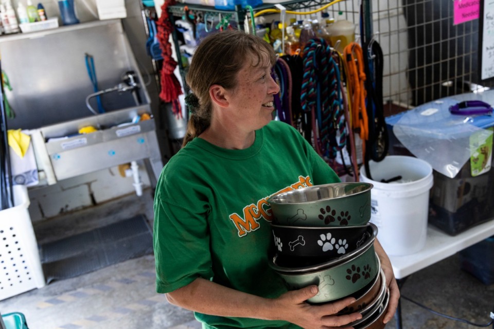 <strong>Petrina Fryer prepares to feed the dogs at the City of Hernando Animal Shelter on March 17. Fryer is the animal control officer for the shelter.</strong> (Brad Vest/Special to The Daily Memphian)