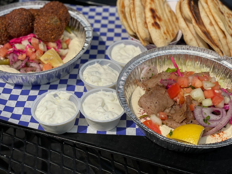<strong>The hummus bowl topped with falafel (left) or with gyro meat are each $8.99 and come with plenty of pita bread at Happy Greek Caf&eacute;.</strong> (Jennifer Biggs/The Daily Memphian)