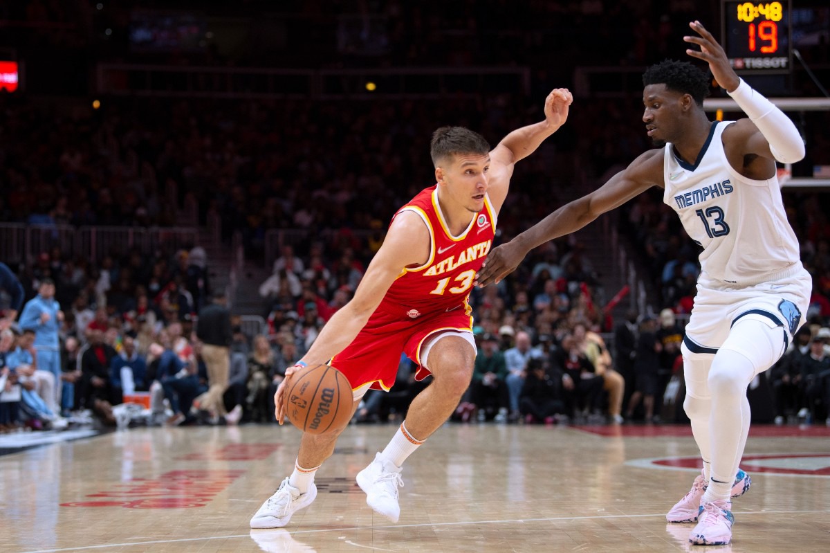 <strong>Atlanta Hawks guard Bogdan Bogdanovic (13) drives against Memphis Grizzlies forward Jaren Jackson Jr. (13)&nbsp;on March 18, 2022, in Atlanta.</strong> (Hakim Wright Sr./AP)