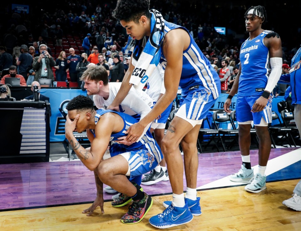 <strong>Tigers guard Landers Nolley II (bottom) is comforted by his teammates after falling to Gonzaga on Saturday, March 19, 2022 at the NCAA tournament in Portland, Oregon.</strong> (Mark Weber/The Daily Memphian)
