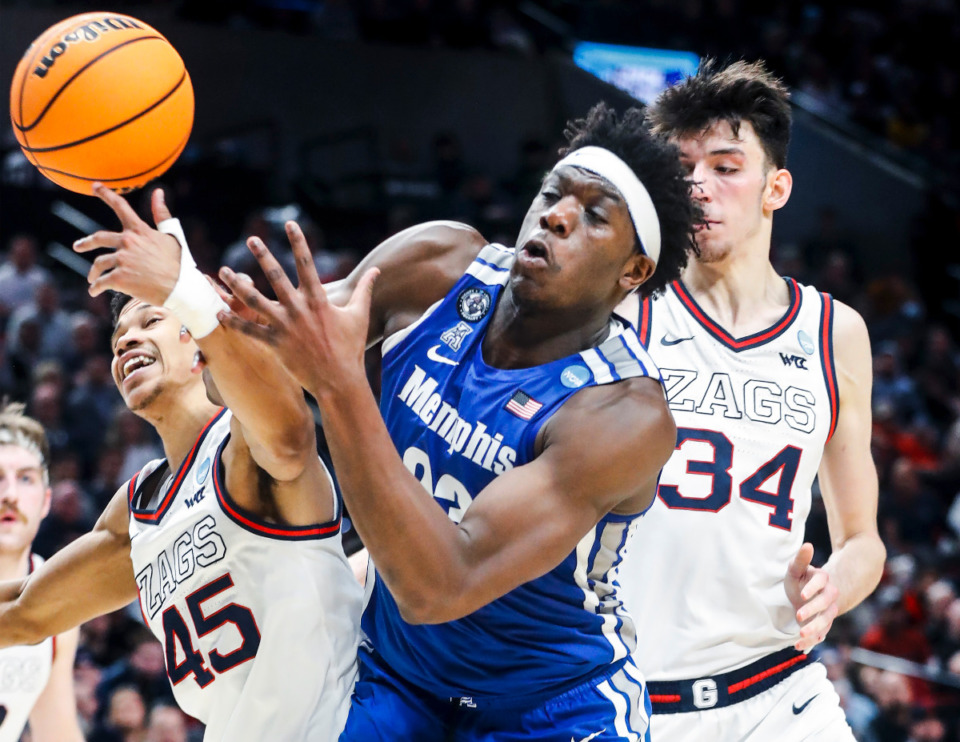 <strong>Tigers center Malcolm Dandridge (right) battles Gonzaga defender Rasir Bolton (left) for a loose ball during action on Saturday, March 19, 2022, at the NCAA tournament in Portland, Oregon.</strong> (Mark Weber/The Daily Memphian)