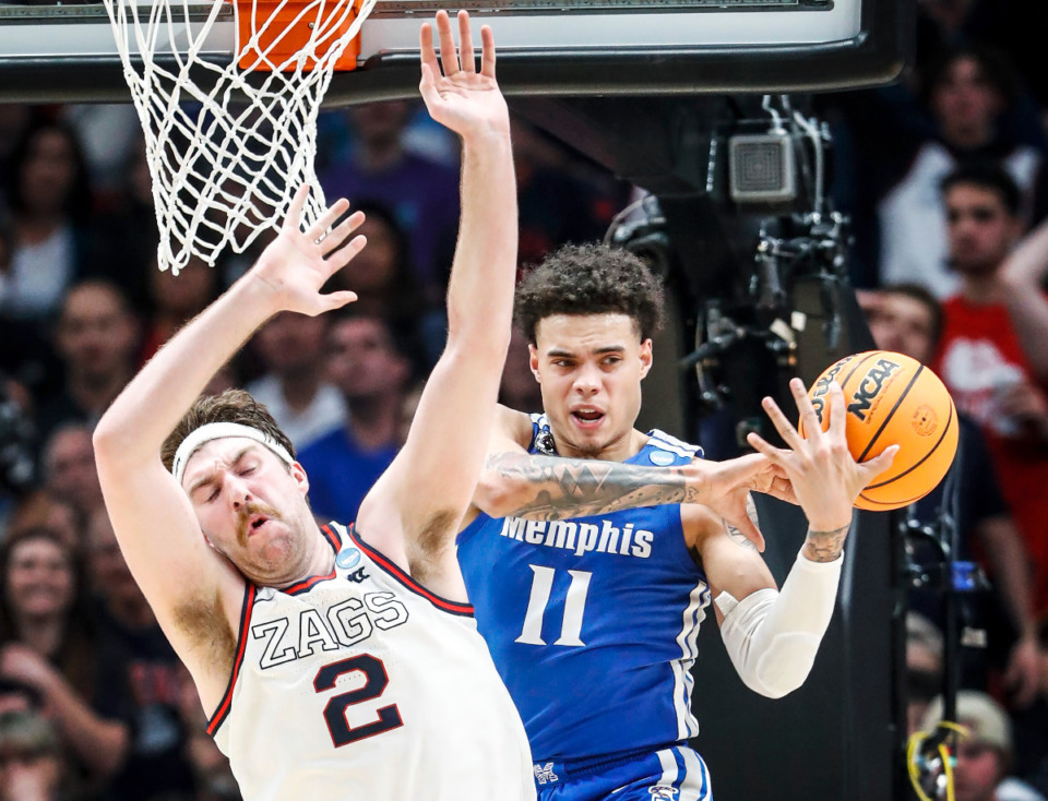 <strong>Tigers guard Lester Quinones (right) battles Gonzaga center Drew Timme (left) for a rebound during action on Saturday, March 19, 2022, at the NCAA tournament game in Portland, Oregon.</strong> (Mark Weber/The Daily Memphian)