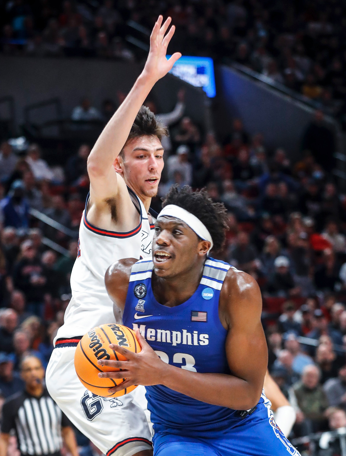 <strong>Tigers center Malcolm Dandridge (right) drives the lane against Gonzaga defender Chet Holmgren (left) during action on Saturday, March 19, 2022, at the NCAA tournament game in Portland, Oregon.</strong> (Mark Weber/The Daily Memphian)