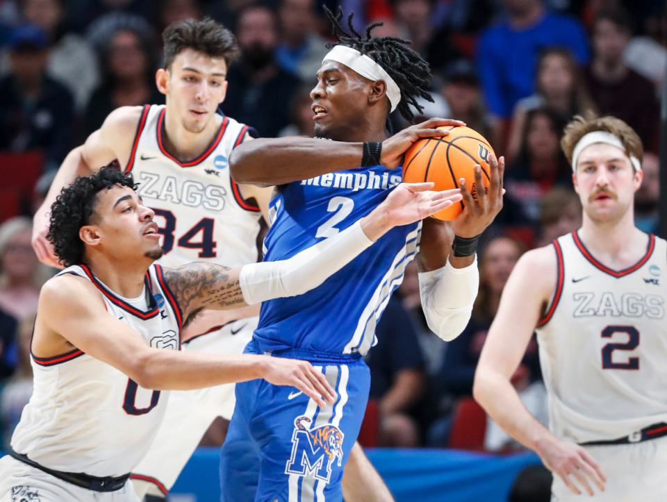 <strong>Tigers center Jalen Duren (center) grabs a rebound away from Gonzaga defender Julian Strawther (left) during action on Saturday, March 19, 2022, at the NCAA tournament game in Portland, Oregon.</strong> (Mark Weber/The Daily Memphian)