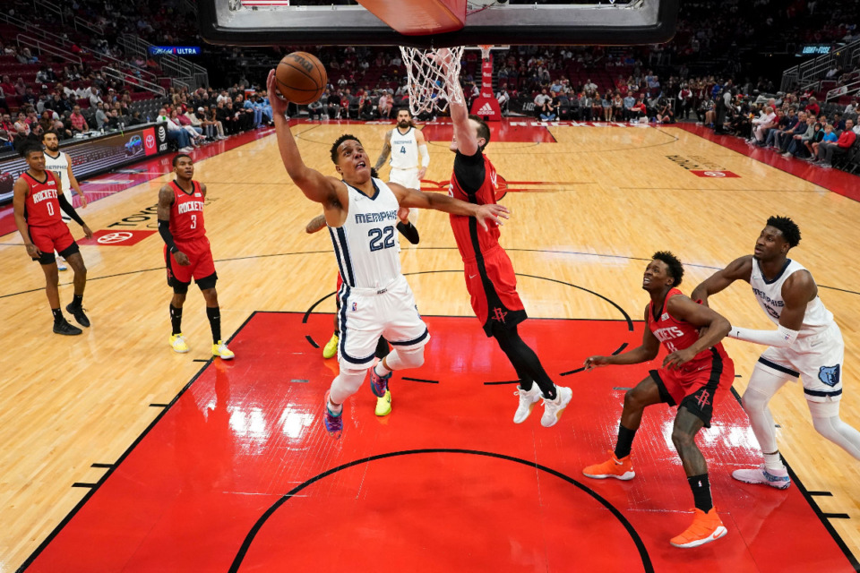 <strong>Memphis Grizzlies guard Desmond Bane (22) drives to the basket as Houston Rockets guard Garrison Mathews, right, defends during the second half of an NBA basketball game, Sunday, March 20, 2022, in Houston.</strong> (AP Photo/Eric Christian Smith)