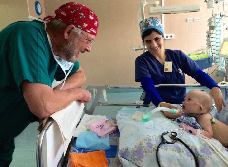 <strong>Dr. William Novick visits a child he operated in Nizhny Novgorod, Russia, in 2014. Novick usually takes his medical mission teams to Russia twice a year, but the Russians cancelled a trip planned for next month.&nbsp;&ldquo;... They said they are having financial problems,&rdquo; Novick said. &ldquo;But nobody really wants to go. Blame Putin. More children will die because of his crimes.&rdquo;</strong> (Courtesy Novick Global Alliance)