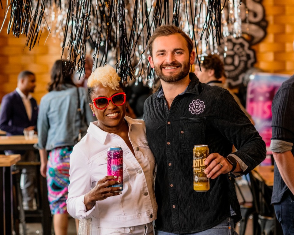 <strong>Paula Raiford (left) and Hopper Seely (right) hosted a reveal party at Grind City Brewery to present two beers they collaborated on together.</strong> (Houston Cofield/Special To The Daily Memphian)