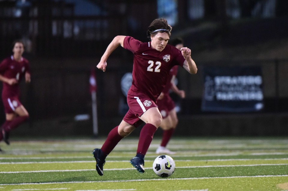 <strong>ECS&rsquo; Luke Ricketts brings the ball up the pitch against CBHS at ECS on March 22, 2022.</strong> (Justin Ford/ Special to The Daily Memphian)