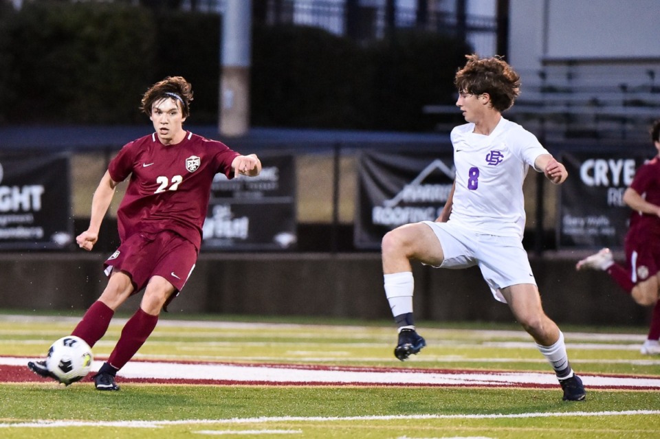<strong>ECS&rsquo; Luke Ricketts kicks the ball as CBHS&rsquo; Cullen Brummer closes in at ECS on March 22.</strong> (Justin Ford/ Special to The Daily Memphian)