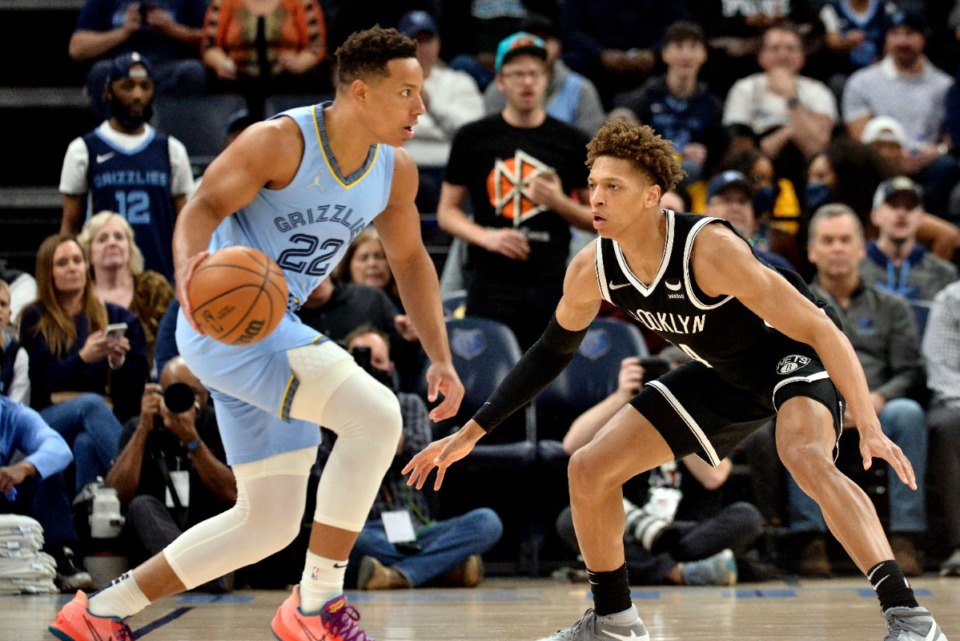 <strong>Memphis Grizzlies guard Desmond Bane (22) is defended by Brooklyn Nets forward Kessler Edwards (14) on March 23, 2022, at FedExForum.</strong> (Brandon Dill/AP)