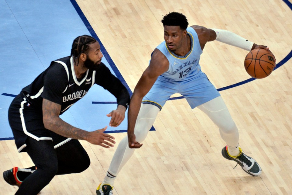 <strong>Memphis Grizzlies forward Jaren Jackson Jr. (13) is defended by Brooklyn Nets center Andre Drummond&nbsp;on March 23, 2022, at FedExForum.</strong> (Brandon Dill/AP)