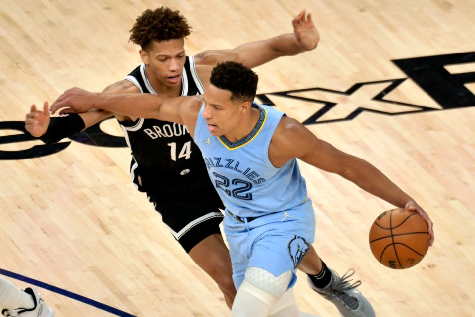 <strong>Memphis Grizzlies guard Desmond Bane (22) works against Brooklyn Nets forward Kessler Edwards (14) March 23, on his way to becoming the first Memphis player to make 203 3-point shots in a single season.</strong>&nbsp;(Brandon Dill/AP)