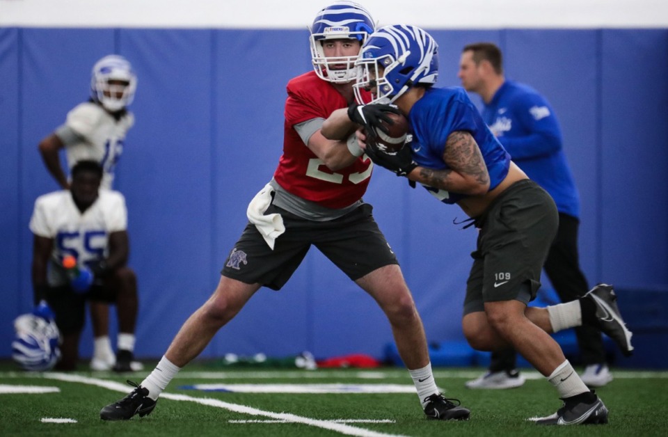 <strong>University of Memphis quarterback Hunter Hulsey (23) hands the ball off at a March 22, 2022 practice.</strong> (Patrick Lantrip/Daily Memphian)