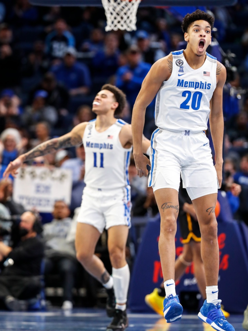 <strong>Memphis teammates Josh Minott (right) and Lester Quinones (left) celebrate during action against Wichita State on Sunday, Feb. 27, 2022.</strong> (Mark Weber/The Daily Memphian)