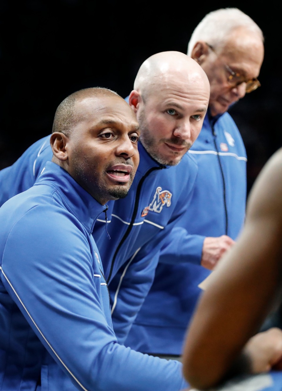 <strong>Tigers head coach Penny Hardaway&nbsp; talks with with assistant coaches Cody Toppert (right) and Larry Brown (far right) during a timeout against Gonzaga on Saturday, March 19, 2022 at the NCAA tournament game in Portland, Oregon.</strong> (Mark Weber/The Daily Memphian)