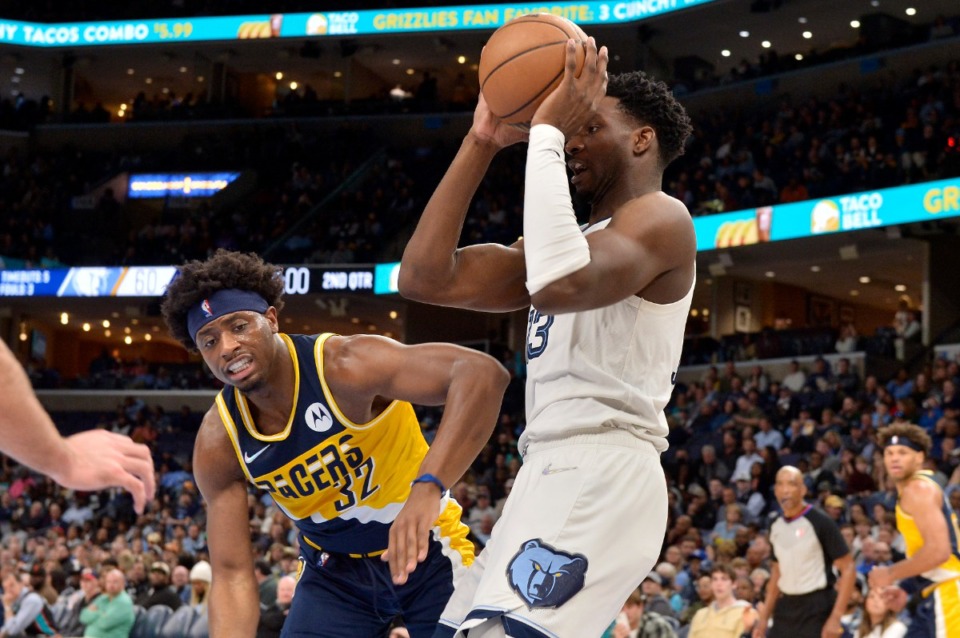 <strong>Memphis Grizzlies forward Jaren Jackson Jr., front right, looks to pass against Indiana Pacers guard Terry Taylor (32) on March 24 at FedExForum.</strong> (Brandon Dill/AP)