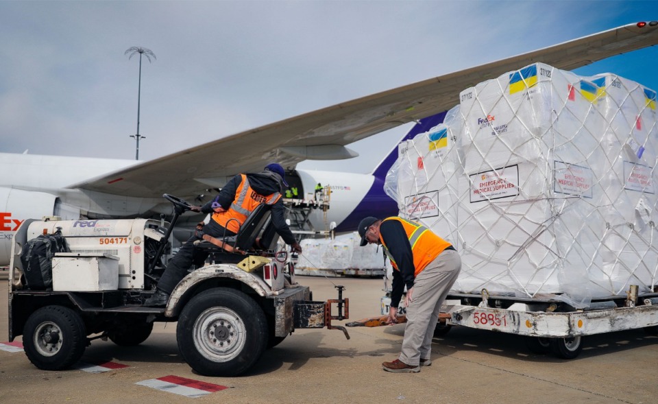<strong>FedEx workers load up carts of aid to be shipped to Ukraine.&nbsp;FedEx announced in early March it would suspend&nbsp;all services in Russia and Belarus.</strong> (Patrick Lantrip/TheDaily Memphian)