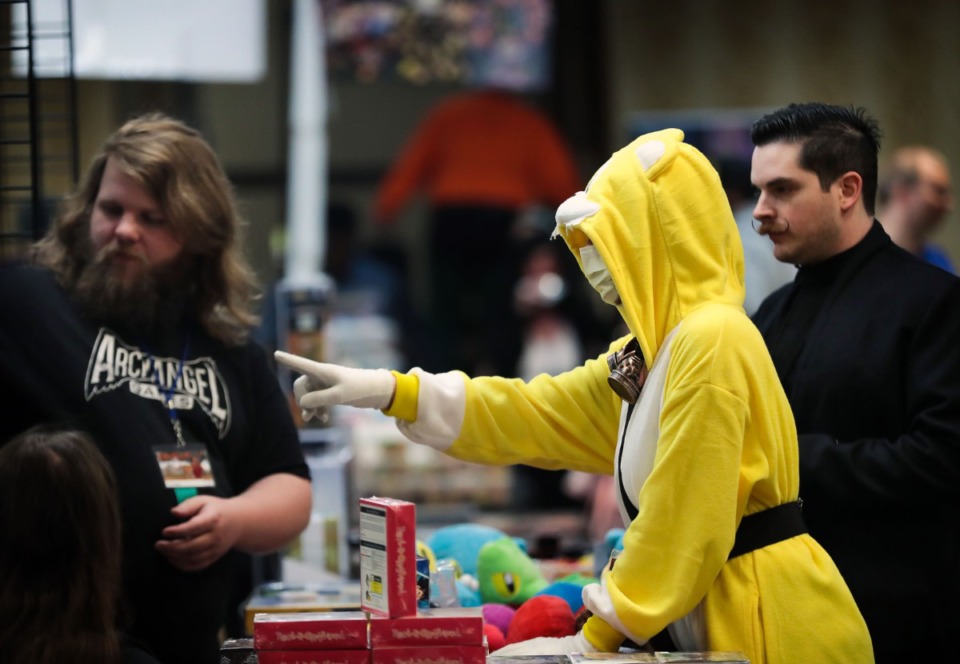 <strong>Elise Covington, dressed as Tails, and Ryan Lawrence, dressed as Dr. Robotnik, shop at MidSouthCon, which was held over the weekend at the Clarion Hotel &amp; Suites on Democrat Road.&nbsp;</strong>(Patrick Lantrip/Daily Memphian)