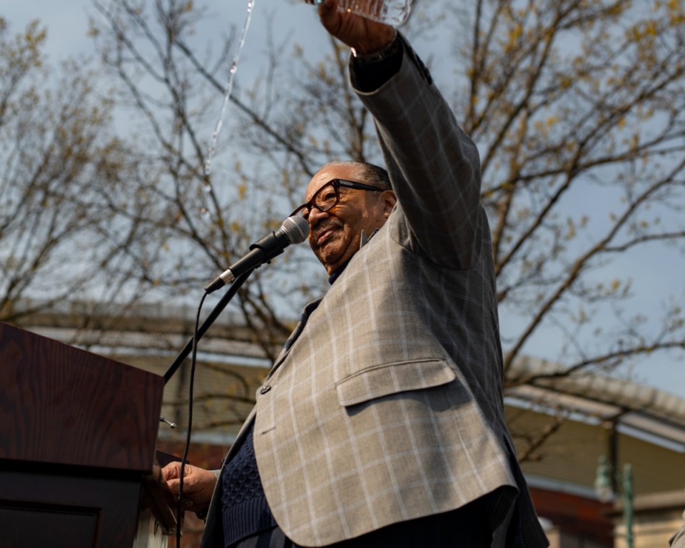 <strong>Apostle William A. Adkins blesses the street name change as he pours out water in the name of civil rights leaders and activists that came before and after Ida B. Wells.</strong> (Houston Cofield/Special To The Daily Memphian)