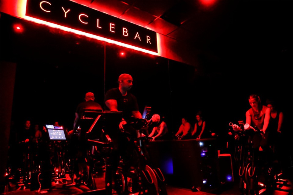 <strong>Participants pedal during a class at the CycleBar fitness facility that opened last week in The Lake District. Owner Jason McAlister compared it to a &ldquo;concert on a bike&rdquo; or a &ldquo;spin class on steroids.&rdquo;</strong> (Mark Weber/The Daily Memphian)