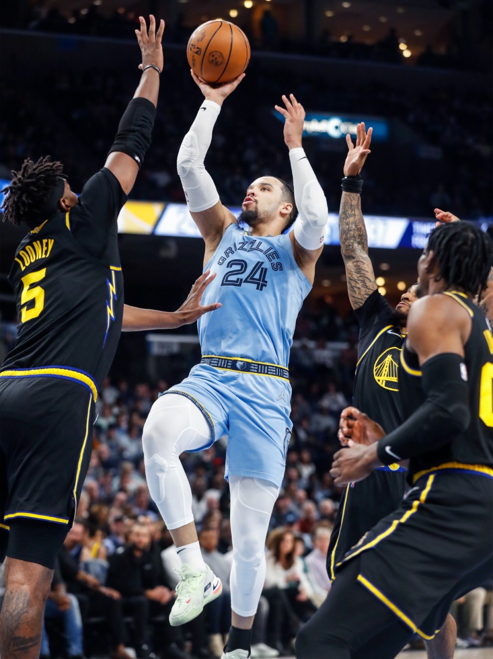 <strong>Memphis Grizzlies guard Dillon Brooks (middle) drives for a basket against the Golden State Warriors&nbsp;on March 28, 2022, at FedExForum.</strong> (Mark Weber/The Daily Memphian)