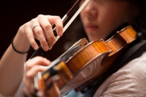 <strong>Violinist Aromi Park rehearses the Brahms&rsquo; &ldquo;German Requiem.&rdquo;</strong> (Daily Memphian file)