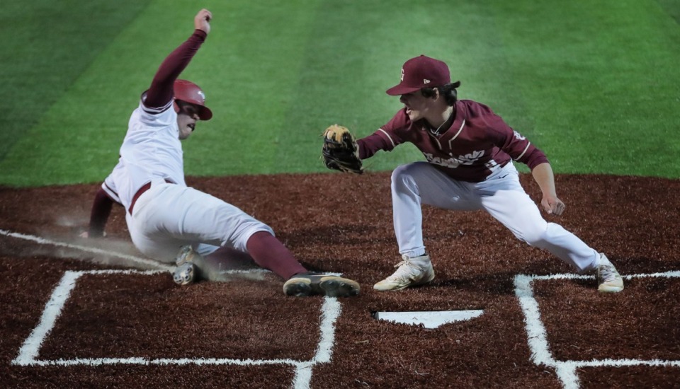 <strong>St.George's pitcher Jake Seward (2) tags a runner out during the game against ECS on March 29.</strong> (Patrick Lantrip/Daily Memphian)