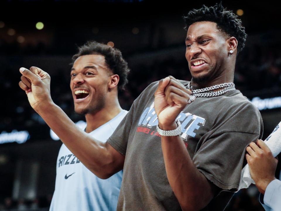<strong>Memphis Grizzlies teammates Xavier Tillman (left) and Jaren Jackson Jr., celebrate a De'Anthony Melton (not pictured) dunk during action against the Golden State Warriors on Monday, March 28, 2022.</strong> (Mark Weber/Daily Memphian file)