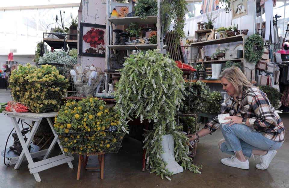 <strong>Lisa Cook with Southern Rust sets up her booth at the Agricenter's Spring Market Apr. 1, 2022.</strong> (Patrick Lantrip/Daily Memphian)