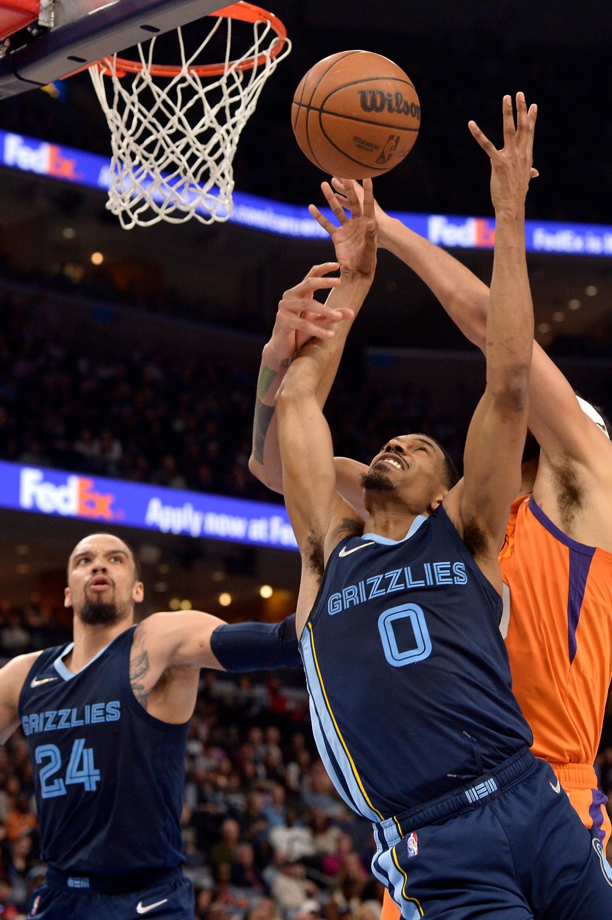 <strong>Memphis Grizzlies guard De'Anthony Melton (0) reaches for the ball ahead of Phoenix Suns center JaVale McGee as forward Dillon Brooks (24) moves for position&nbsp;on April 1, 2022, at FedExForum.</strong> (Brandon Dill/AP)