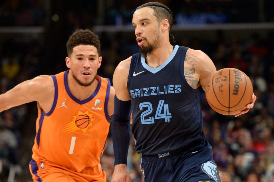 <strong>Memphis Grizzlies forward Dillon Brooks (24) drives past Phoenix Suns guard Devin Booker (1)&nbsp;on April 1, 2022, at FedExForum.</strong> (Brandon Dill/AP)