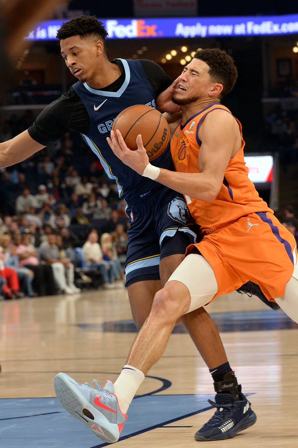 <strong>Phoenix Suns guard Devin Booker, right, drives against Memphis Grizzlies guard Jarrett Culver on April 1 at FedExForum.</strong> (Brandon Dill/AP)