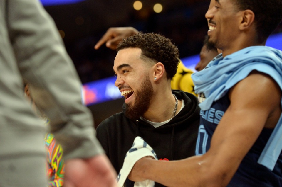 <strong>Memphis Grizzlies guards Tyus Jones, center, and De'Anthony Melton (0) react with joy in the against the Phoenix Suns on April 1 at FedExForum.</strong> (Brandon Dill/AP)