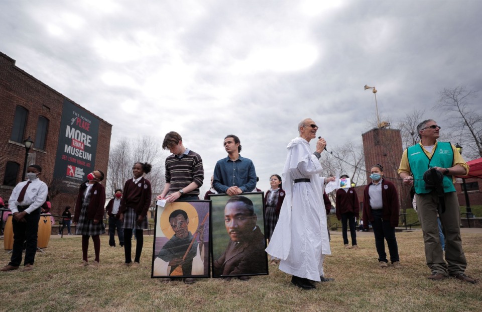 <strong>White Station junior Sam Shiberou (holding a photo of Dr. Martin Luther King) was among the youngsters who spoke at the PrayWalk event Saturday.</strong> (Patrick Lantrip/Daily Memphian)