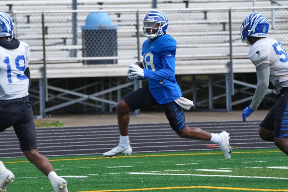 <strong>Eddie Lewis eludes defense during Saturday&rsquo;s spring scrimmage.</strong> (Harrison McClary/Special to The Daily Memphian)