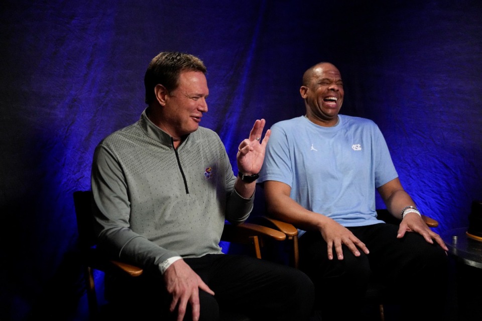 <strong>Kansas head coach Bill Self, left, and North Carolina head coach Hubert Davis talk during a CBS Sports interview ahead of the Men's Final Four NCAA basketball tournament, Sunday, April 3, 2022, in New Orleans. North Carolina will face Kansas in the final game on Monday.</strong> (AP Photo/David J. Phillip)