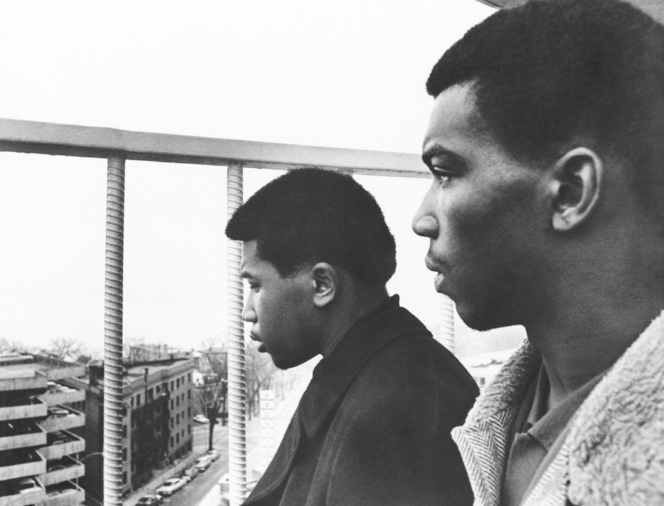 <strong>James Alexander (left), and Carl Simms, both of Memphis, look out the window at&nbsp;the Madison Hotel in Madison, Wis., on Dec. 11, 1967. Below is the lake in which the plane bearing singer Otis Redding and seven others crashed a day earlier. Alexander and Simms were unable to board Redding's private plane in Cleveland because of lack of space.</strong> (AP Photo/File)