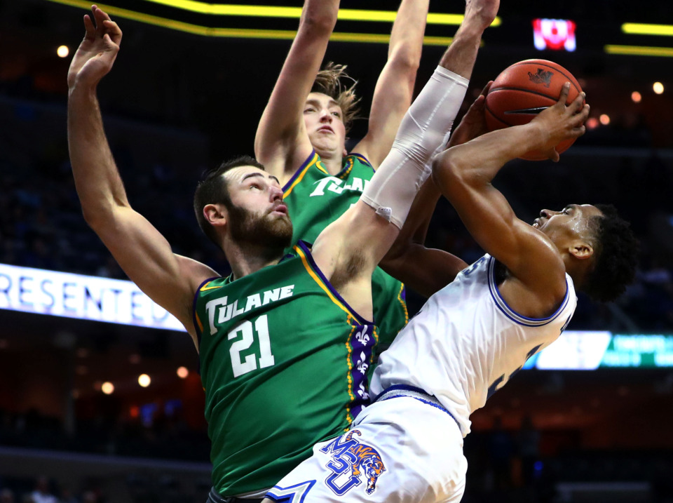 <strong>University of Memphis guard Jeremiah Martin (3) pulls back for a shot against Tulane Green Wave forward Samir Sehic (21) and guard/forward Moses Wood (4) during a game against the Green Wave on Wednesday, Feb. 20, 2019. The Tigers take on the Green Wave today in the first round of AAC tournament play.</strong> (Houston Cofield/Daily Memphian)