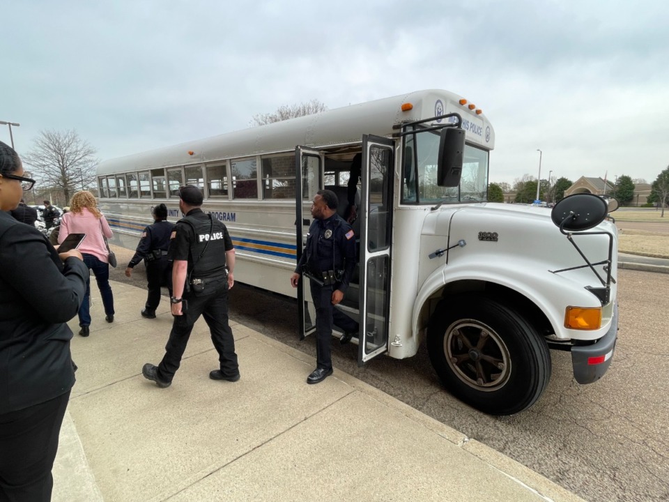 <strong> Police officers exit the MPD Community Outreach Program bus after the Operation Hands Free bus tour, hosted by the Tennessee Highway Safety Office and its partners.</strong> (Julia Baker/Daily Memphian)