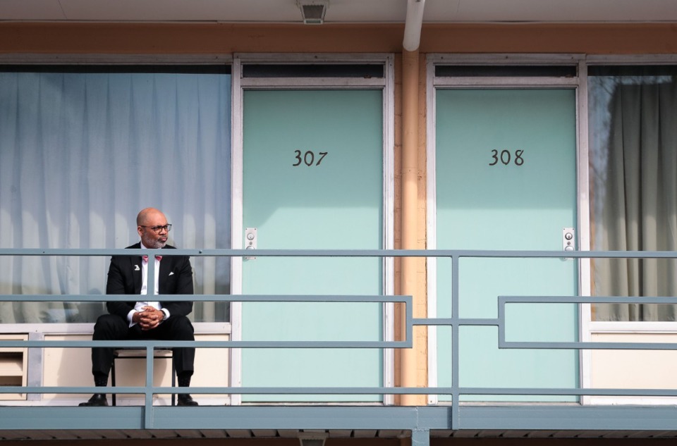 <strong>National Civil Rights Museum president Dr. Russ Wigginton sits alone on the balcony where Dr. Martin Luther King Jr. was shot in 1968. (</strong>Patrick Lantrip/Daily Memphian)