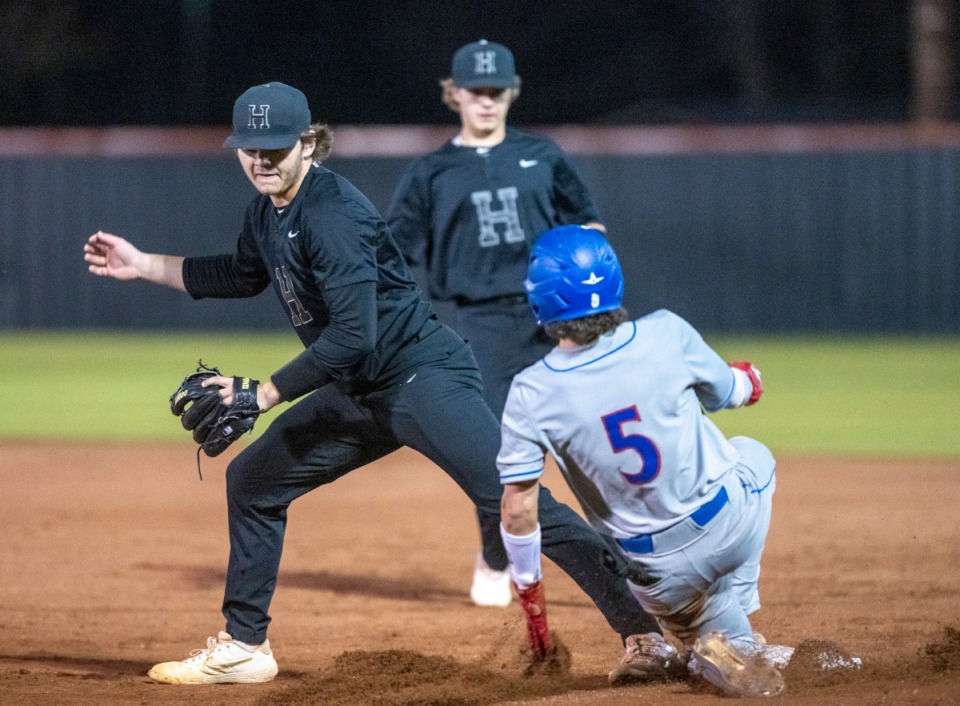 <strong>Bartlett's Micah White slides safe into second base as Houston's second baseman Nolan Tanner waits for the ball in Monday's district contest at Houston.</strong> (Greg Campbell/Special to The Daily Memphian)