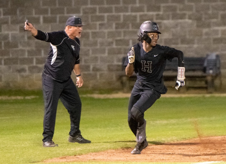 Houston's Robbie Martin is waved on to home after Dean McCalla hit a double into right field during Monday's game against Bartlett. (Greg Campbell/Special to The Daily Memphian)