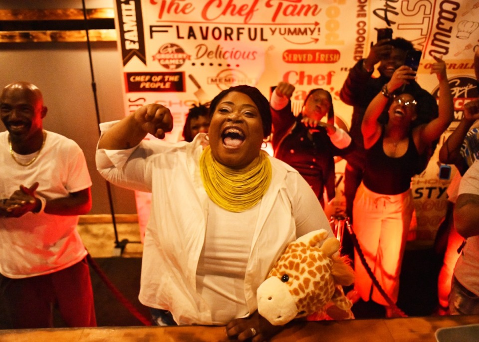 <strong>Friends and family of chef Tam Patterson, owner of Chef Tam's Underground, gathered at her restaurant to watch her winning announcement on the television show Chopped.</strong> (Houston Cofield/Special To The Daily Memphian)