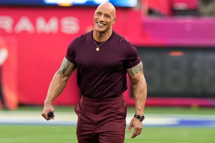 Dwayne "The Rock" Johnson smiles before the NFL Super Bowl 56 football game between the Los Angeles Rams and the Cincinnati Bengals, Sunday, Feb. 13, 2022, in Inglewood, California. (AP Photo/Chris O'Meara)