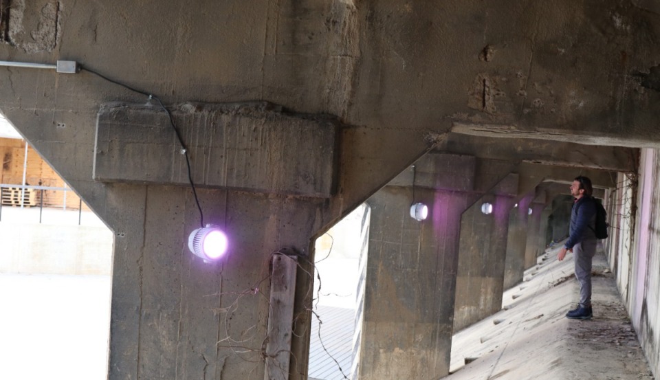 <strong>Ethan Knight stands underneath the overpass at the Edge. Stage lights were installed under the support beams for future shows.</strong>&nbsp;(Neil Strebig/The Daily Memphian)